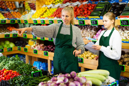 Young girl internship at first job at grocery shop
