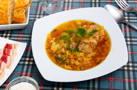Russian dish Shchi - sour cabbage soup served in bowl