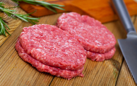 Raw minced beef patties for hamburgersの写真素材