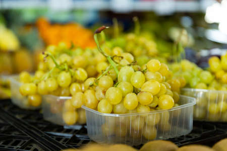 Bunch of grapes in a fruit shop or at supermarketの写真素材
