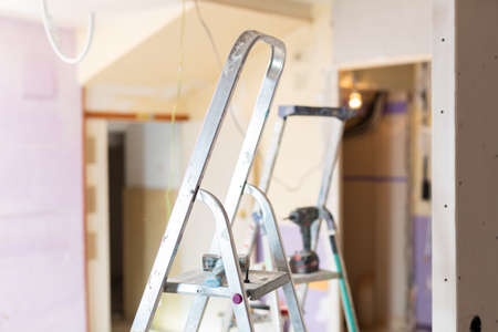 Photo of stepladders in empty apartment, reconditioning workの写真素材