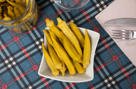 Marinated okra pods served on plate