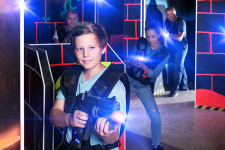 Teen boy playing laser tagの写真素材