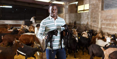 Farmworker with goatlings