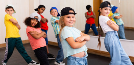 Preteen girls and boys hip hop dancers doing dance workout