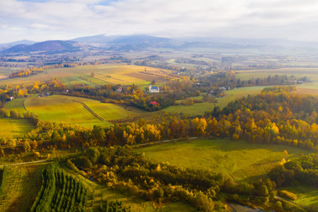 Picturesque autumn view with church on a hillの写真素材