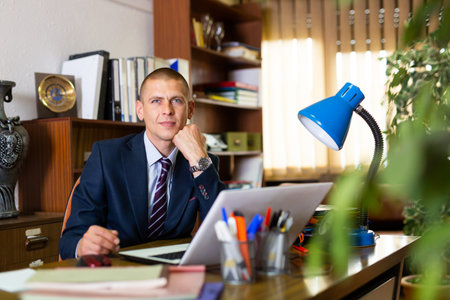 Portrait of young man working at office
