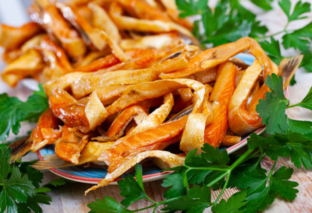 Delicious smoked salmon strips with parsleyの写真素材