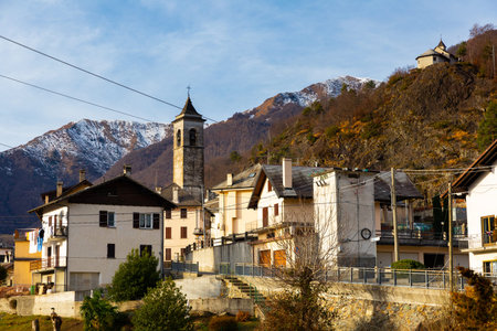 Alpine township of Finero on background of snowy mountains in winter