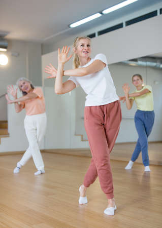Woman dancing during group classの写真素材