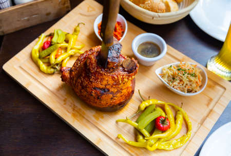 Popular dish of Austrian cuisine is roasted pork knuckle in beer sauceの写真素材