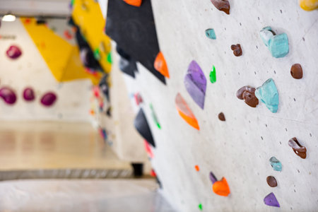 Climbing wall with grips in bouldering center