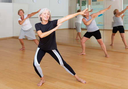 Mature women practice active dancing in the studioの写真素材