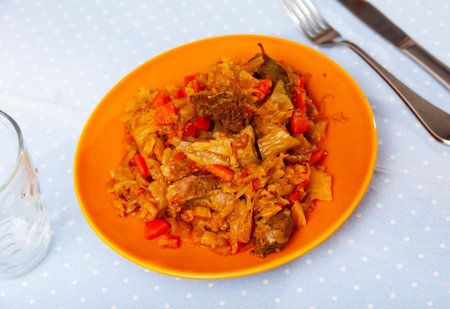 Plate of braised sauerkraut with fried pork meat