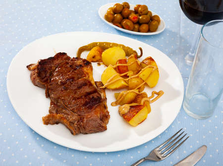 Steak with grilled vegetables potatoes and peppersの写真素材