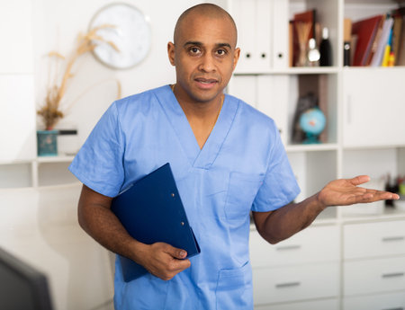 Therapist is standing with documents