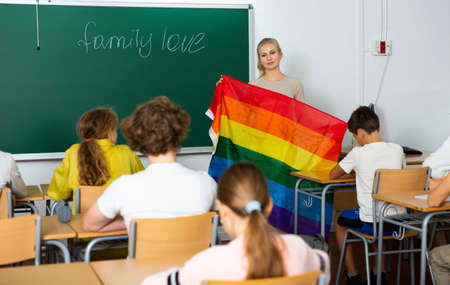 Teacher explaining lgbt theme to children during lessonの写真素材