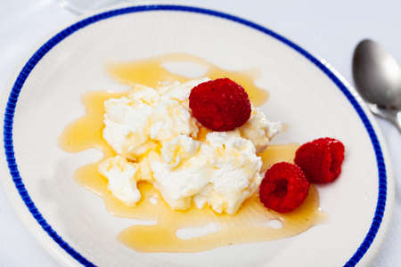 Catalan dessert - fresh cheese Mato with honey and strawberryの写真素材