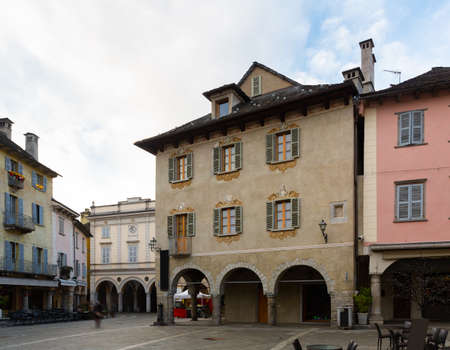 Medieval buildings in square Piazza del Mercato of Domodossola in winter, Italyの写真素材