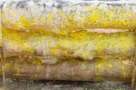 Traces of paintball weapons on wooden constructions