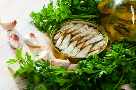 Open tin can with sardines in oilの写真素材