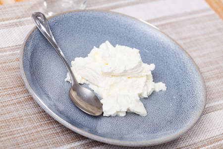 View of appetizing young cheese on plateの写真素材