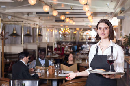 Waitress with serving trayの写真素材