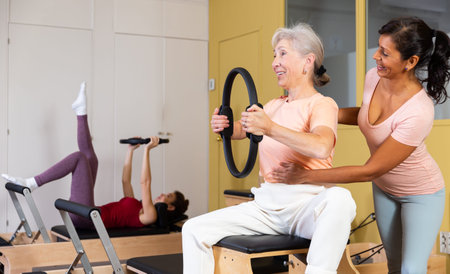 Mature European woman performing an exercise with a special ring