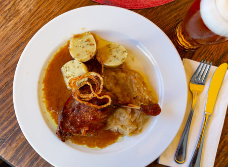 Confit duck leg with sauerkraut and dumplings