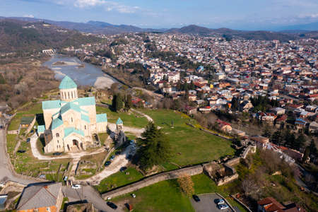 View from drone of Bagrati Cathedral in Kutaisi against cityscapeの写真素材