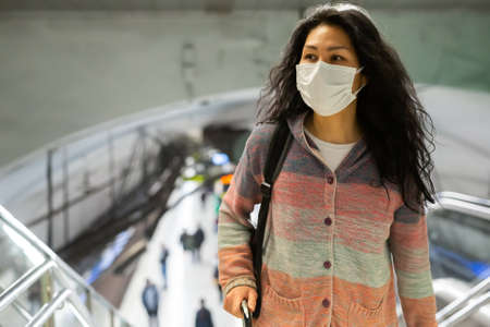 Woman walking at hall of subway stationの写真素材