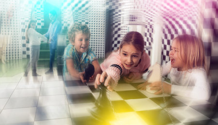 Tweens trying to get out of escape room, toned image with circular blur