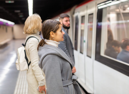 Passengers enter subway cars