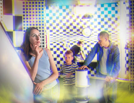 Young woman contemplating solving puzzle in quest roomの写真素材