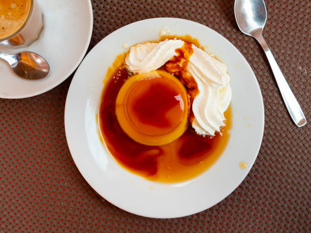 Sweet custard flan with air whipped cream and caramel