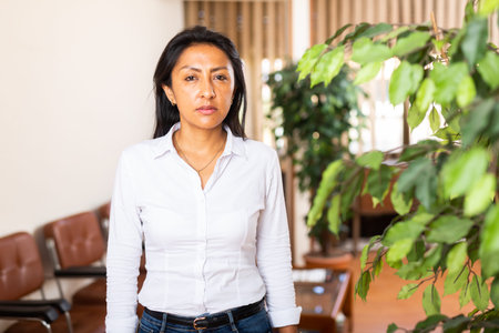 Portrait of business woman standing in office
