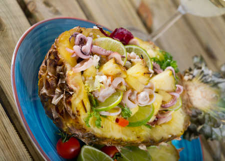 Salad with calamari, pineapple and limeの写真素材