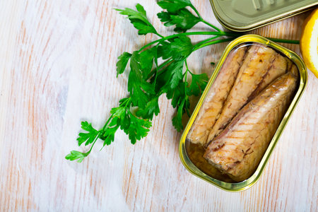 Scomber fillets in sunflower oil with parsley and lemonの写真素材