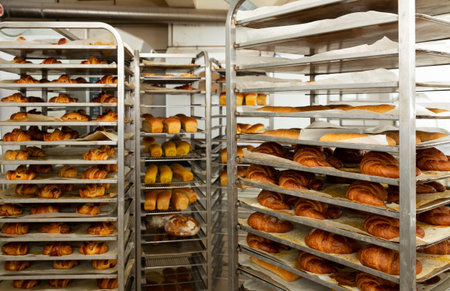 Freshly baked bread on trolley in bakery