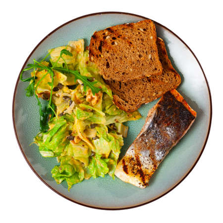 Appetizing salmon with a vegetable saladの写真素材