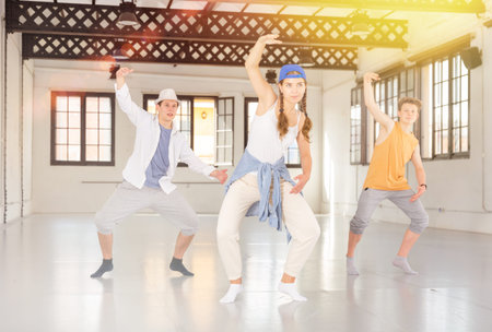 Teenage dancers training hip hop at studio