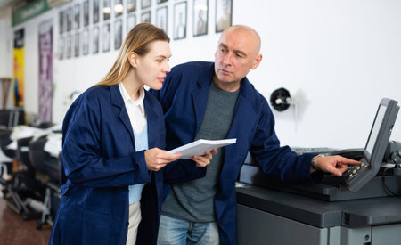 Man and woman working in printshop