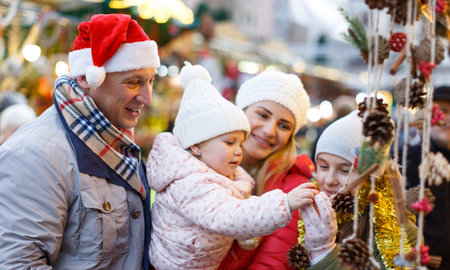 Family portrait at Christmas fairの写真素材
