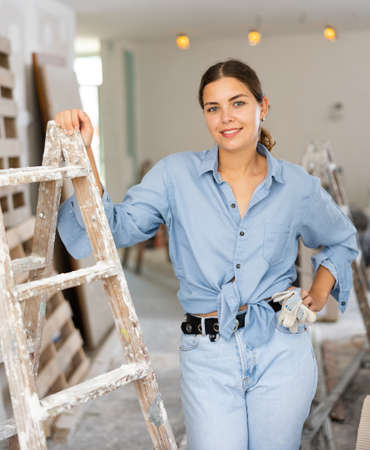 Portrat of cheerful young woman inside construction siteの写真素材