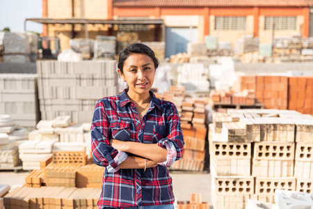 Portrait of woman seller of building materials at an open-air siteの写真素材