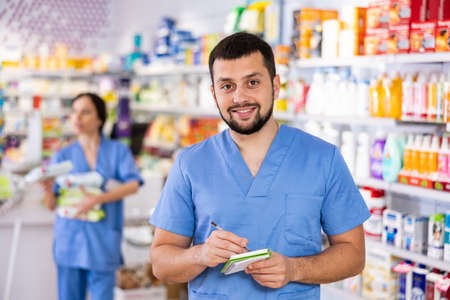Portrait of male druggist in drugstoreの写真素材