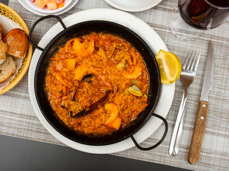Traditional dish of Spanish cuisine is paella with seafoodの写真素材