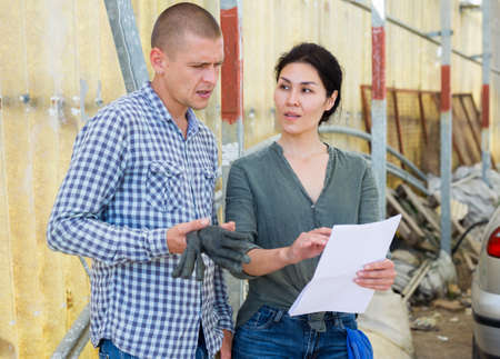 Two people with documentsの写真素材