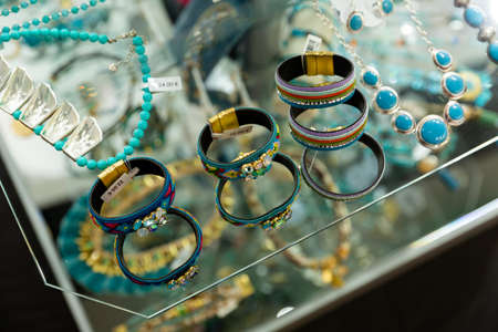 Various adornments on showcase in bijouterie shopの写真素材