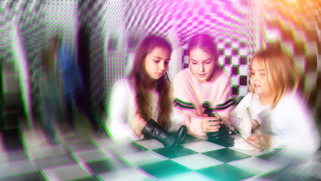 Enthusiastic children play in chess quest room